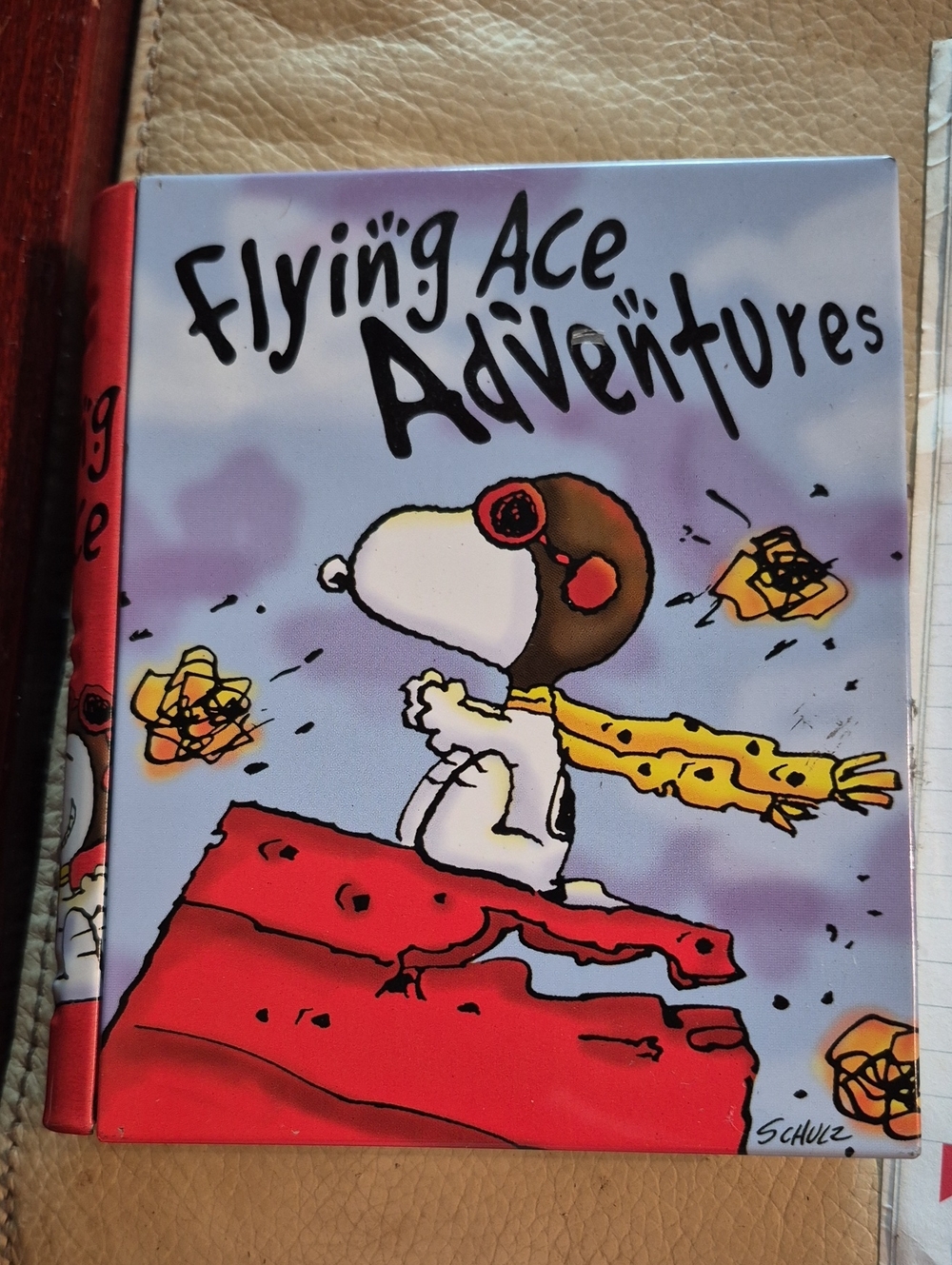 Peanuts Hardcover with Purple Clouds and Red Spine Tin